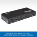 AV:Link 4K HDMI splitter 1 in 2 out, shown as a black rectangular electronic device with DC/5V input, OUTPUT1, INPUT, and OUTPUT2 ports, on a white patterned background with a blue text banner at the bottom.