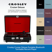 Crosley Cruiser Deluxe portable Bluetooth turntable record player shown open, with a bright red interior and black exterior. The image includes a color selection chart on the right listing available finishes such as turquoise, burgundy, navy, purple ash, mint, lavender, fawn, chalkboard, and black, plus text reading 'Choose from a range of different colours!'.