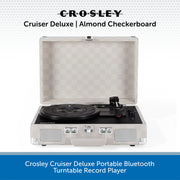 Crosley Cruiser Deluxe portable Bluetooth turntable record player in an open aluminum case with an almond checkerboard interior, shown on a white background with blue text banners.
