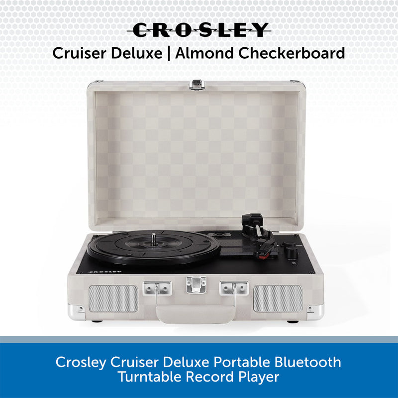 Crosley Cruiser Deluxe portable Bluetooth turntable record player in an open aluminum case with an almond checkerboard interior, shown on a white background with blue text banners.