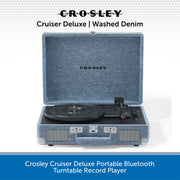 Crosley Cruiser Deluxe portable Bluetooth turntable record player in washed denim blue fabric exterior, shown open with the turntable inside against a white background with blue text banners.