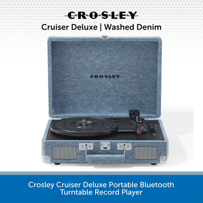 Crosley Cruiser Deluxe portable Bluetooth turntable record player in washed denim blue fabric exterior, shown open with the turntable inside against a white background with blue text banners.