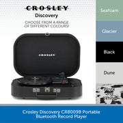 Crosley Discovery portable Bluetooth record player shown open, with a color selection graphic on the right listing Seafoam, Glacier, Black, and Dune.