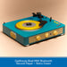 Blue and yellow record player with a yellow record on a beige background