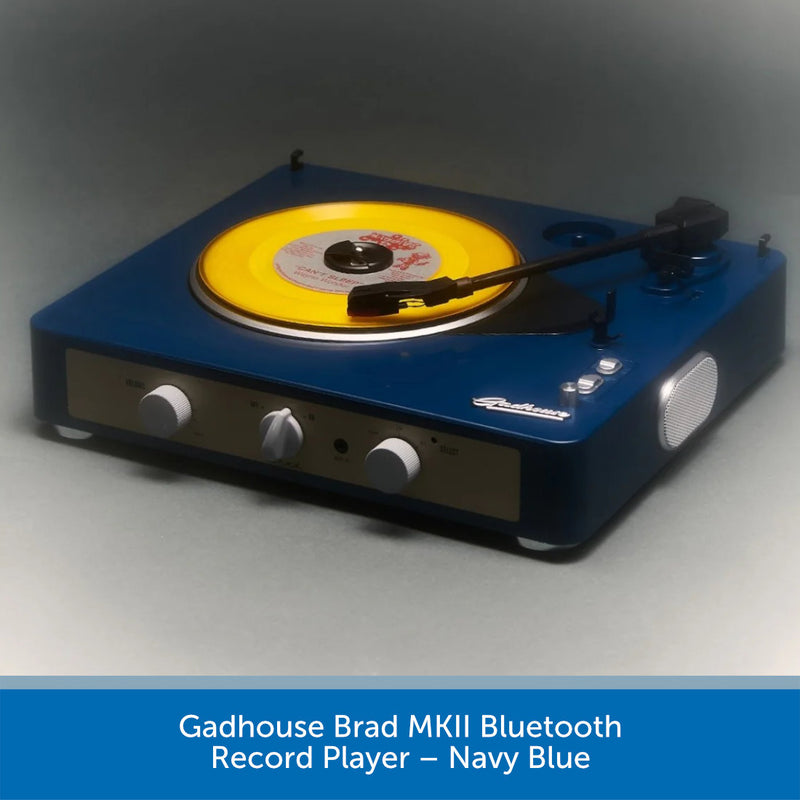 Navy blue record player with yellow record on a gray background