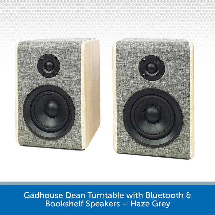 Pair of bookshelf speakers with haze grey finish on a white background
