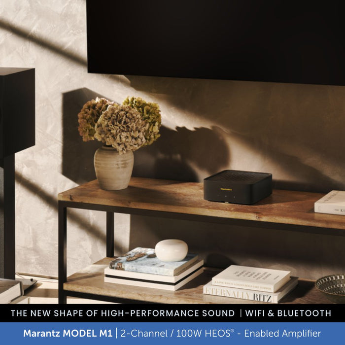 Wooden shelf with a Marantz MODEL M1 amplifier, books, and a vase in a home setting.