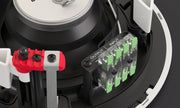 Close-up of electronic components with red and green connectors on a black background