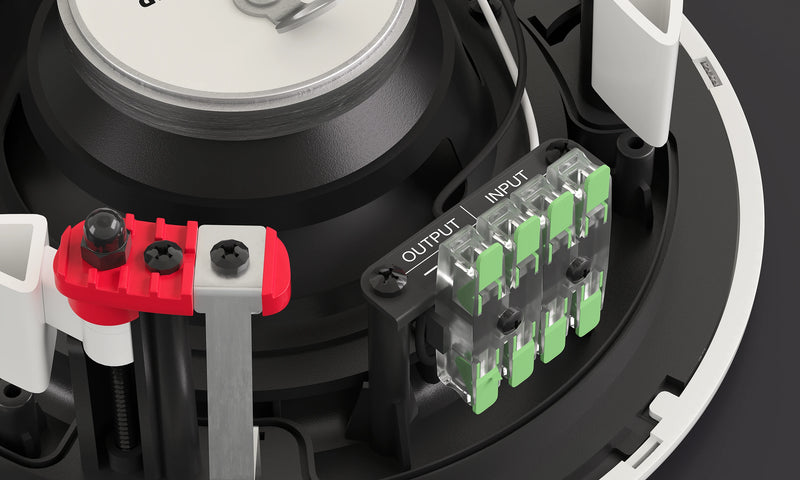 Close-up of electronic components with red and green connectors on a black background
