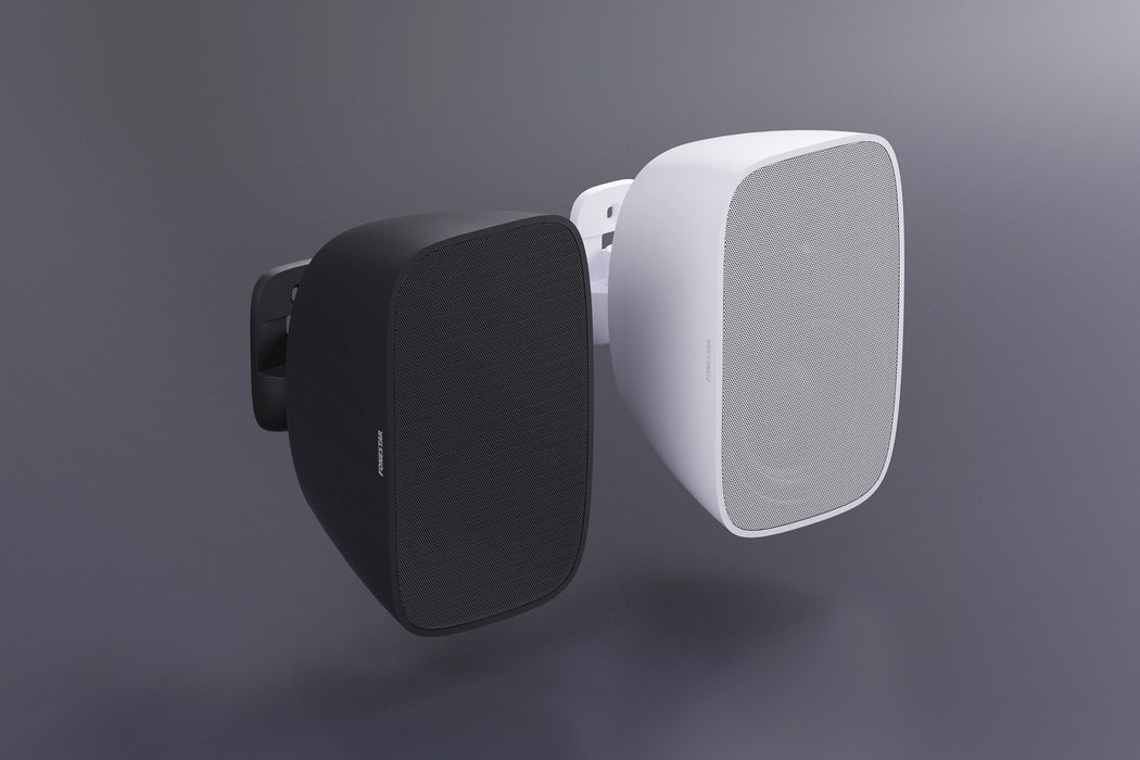 Black and white outdoor speakers on a gray background