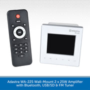 Adastra WA-225 wall-mount 2x25W amplifier shown with its black remote control and white front panel on a light gray patterned background, with a blue text banner at the bottom describing Bluetooth, USB/SD, and FM tuner features.