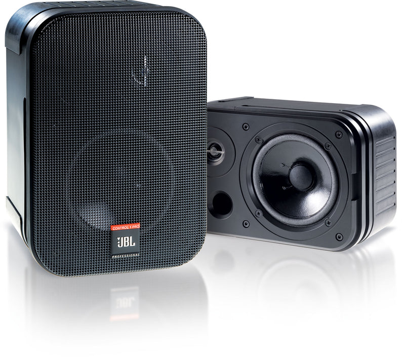 A pair of JBL Control 1 Pro wall speakers, one in black and one in white, each with a front-firing woofer and a tweeter.